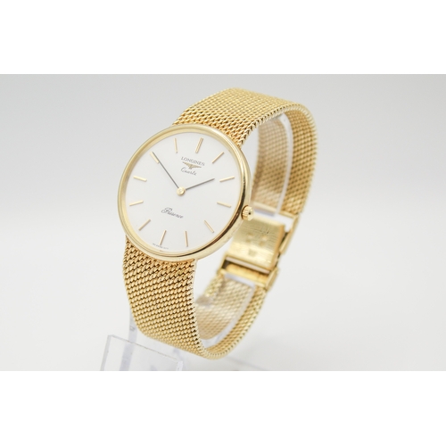 215 - A 9ct gold Longines Presence quartz wristwatch. Model 35002, with gilt markers to the white face, ma... 