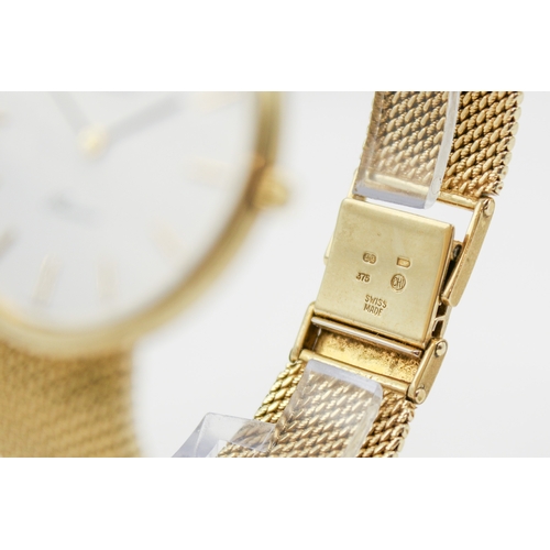 215 - A 9ct gold Longines Presence quartz wristwatch. Model 35002, with gilt markers to the white face, ma... 