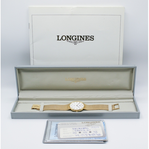 215 - A 9ct gold Longines Presence quartz wristwatch. Model 35002, with gilt markers to the white face, ma... 