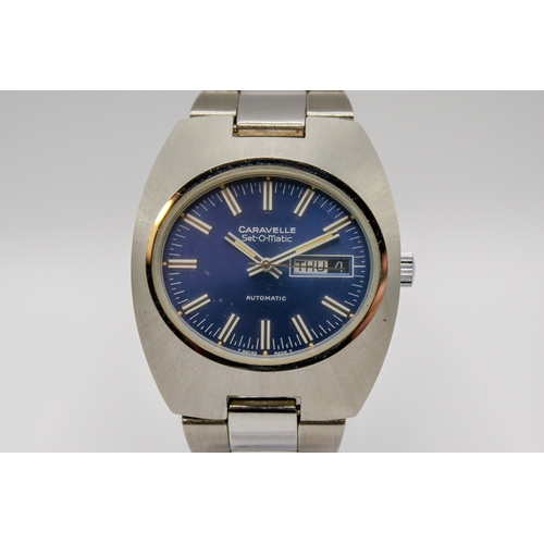 229 - A circa 1970s Caravelle Set-O-Matic by Bulova gentleman's stainless steel wristwatch. Having a blue ... 
