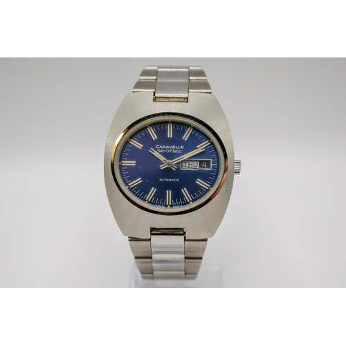 229 - A circa 1970s Caravelle Set-O-Matic by Bulova gentleman's stainless steel wristwatch. Having a blue ... 