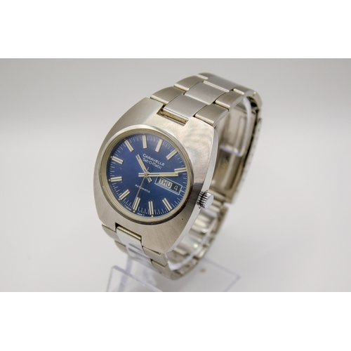 229 - A circa 1970s Caravelle Set-O-Matic by Bulova gentleman's stainless steel wristwatch. Having a blue ... 