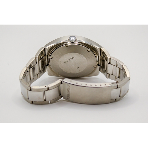 229 - A circa 1970s Caravelle Set-O-Matic by Bulova gentleman's stainless steel wristwatch. Having a blue ... 