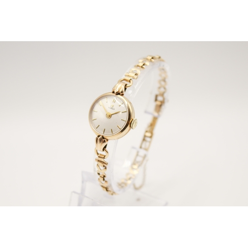 238 - A 9ct gold vintage lady's Tissot dress watch. The round face with gilt marker, hallmarked inside bac... 