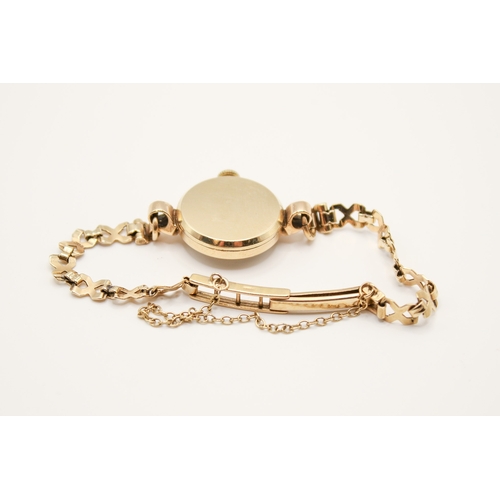 238 - A 9ct gold vintage lady's Tissot dress watch. The round face with gilt marker, hallmarked inside bac... 