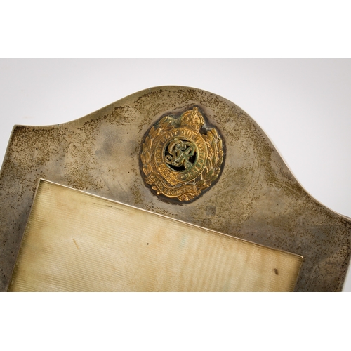 30 - A silver desk calendar and a silver photograph frame. The calendar of Art Nouveau style with loose m... 