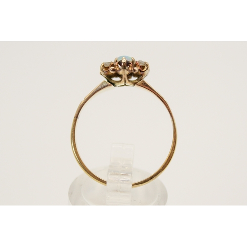 86 - An 18ct gold (tested) dress ring. Set centrally with one oval cabochon cut opal of 0.17 carats with ... 