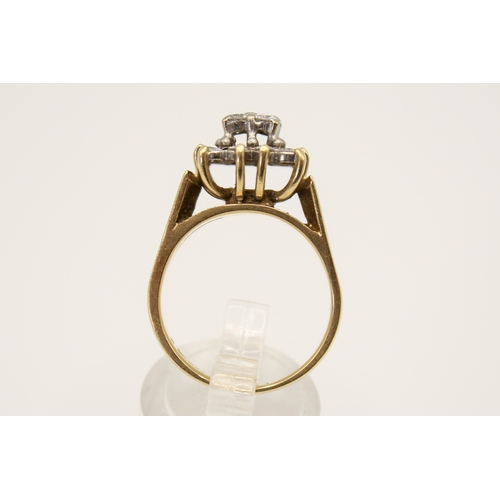 97 - An 18ct gold and diamond cluster ring. Set with sixteen small round cut diamonds in a raised, square... 