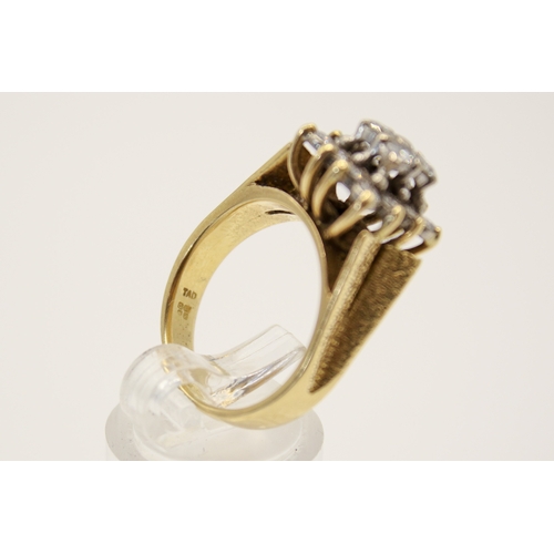 97 - An 18ct gold and diamond cluster ring. Set with sixteen small round cut diamonds in a raised, square... 
