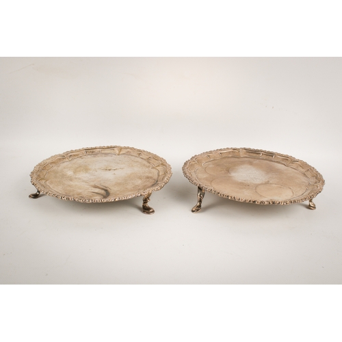 61 - A pair of 19th century Irish silver round trays. With shaped rims, central engraved crown over gryph... 