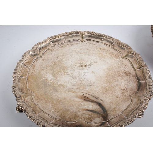 61 - A pair of 19th century Irish silver round trays. With shaped rims, central engraved crown over gryph... 