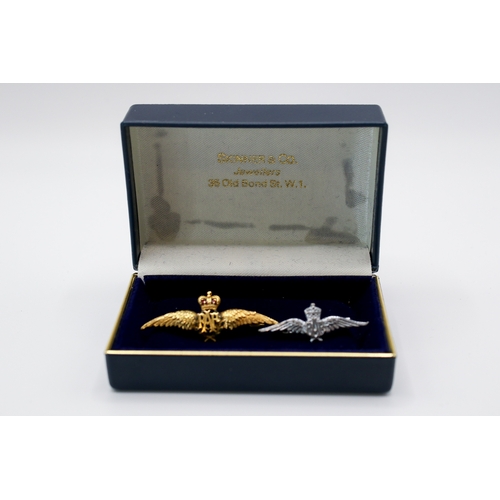 189 - A 9ct gold RAF 'sweetheart' pin badge and a white metal example. The first with green and red enamel... 