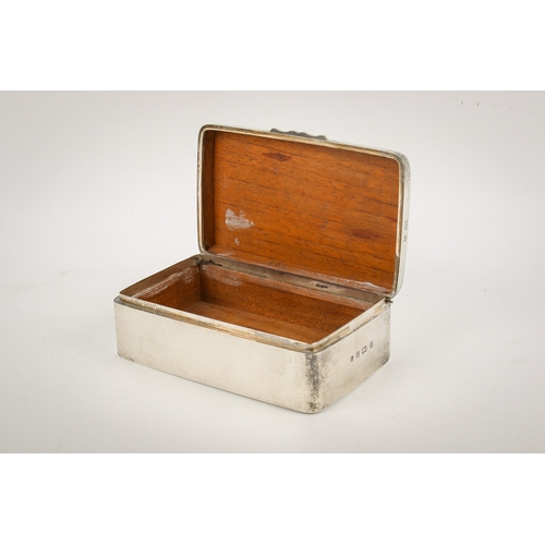 20A - An early 20th century silver cigarette box. Undecorated, with rounded corners and serpentine shallow... 