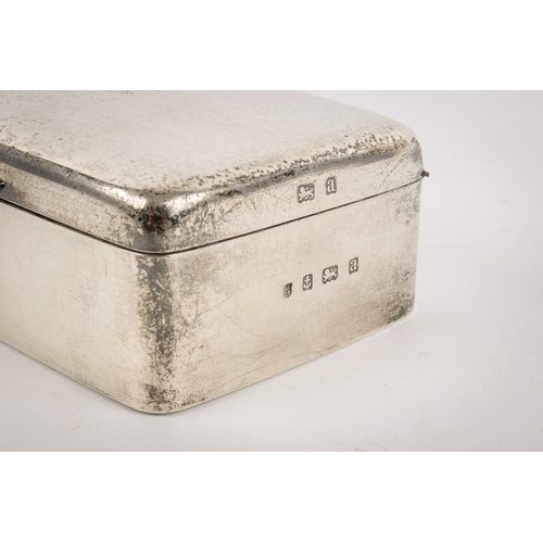 20A - An early 20th century silver cigarette box. Undecorated, with rounded corners and serpentine shallow... 