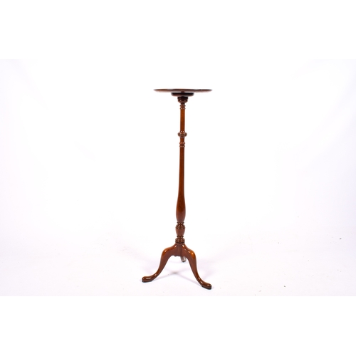 135 - A 20th century Georgian style mahogany tripod pedestal plant stand. H107cm