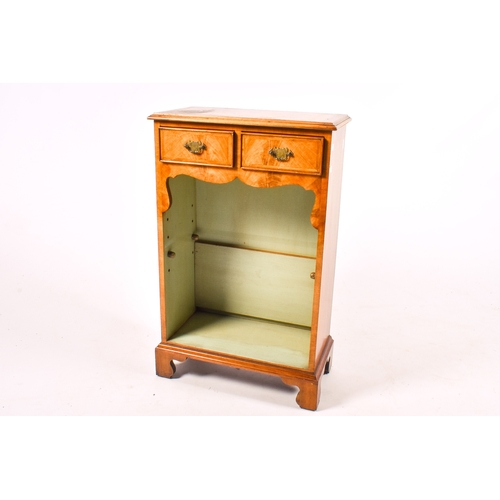 169 - A 20th century Georgian style mahogany side cabinet with two drawers. With an adjustable shelf benea... 