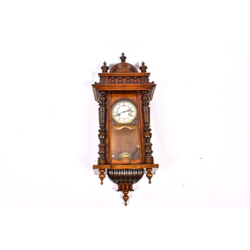 281 - A late 19th century walnut cased Vienna style wall clock. 33cm x 86cm x 20cm