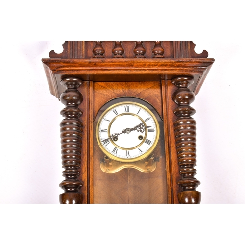 281 - A late 19th century walnut cased Vienna style wall clock. 33cm x 86cm x 20cm