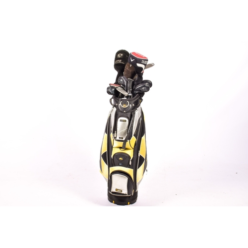 288 - A Cobra golf bag with a set of assorted clubs. Including a Ping Dardy putter and a Callaway Big Bert... 