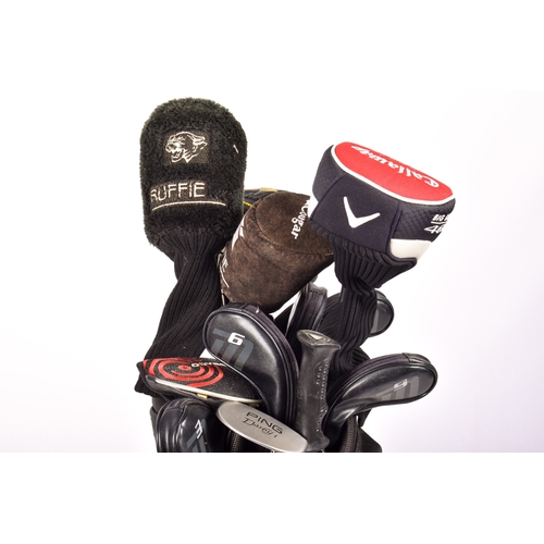 288 - A Cobra golf bag with a set of assorted clubs. Including a Ping Dardy putter and a Callaway Big Bert... 