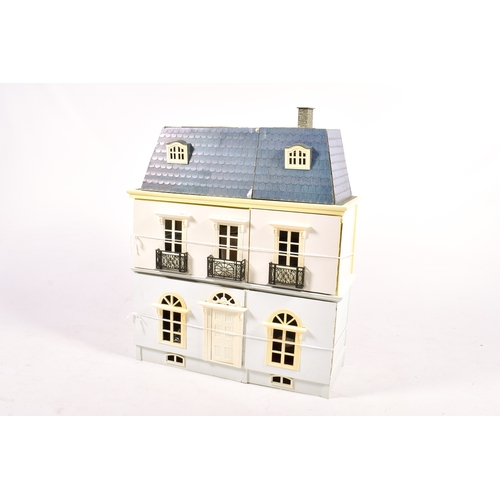 292 - A French style doll's house and contents. H75cm x W67cm x D25cm