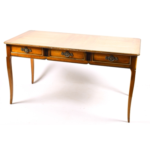 305 - A 20th century French writing table. Three frieze drawers, blind drawers to the rear. Raised on squa... 