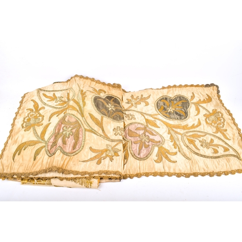 31 - An assortment of antique and later embroidered fabric. Including a runner heavily embroidered in met... 
