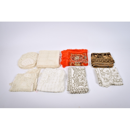 148 - A collection of assorted vintage table linen. Including lace table cloths, lace doilies, etc.