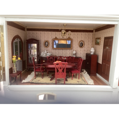 292 - A French style doll's house and contents. H75cm x W67cm x D25cm