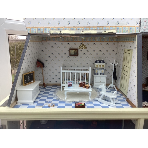 292 - A French style doll's house and contents. H75cm x W67cm x D25cm