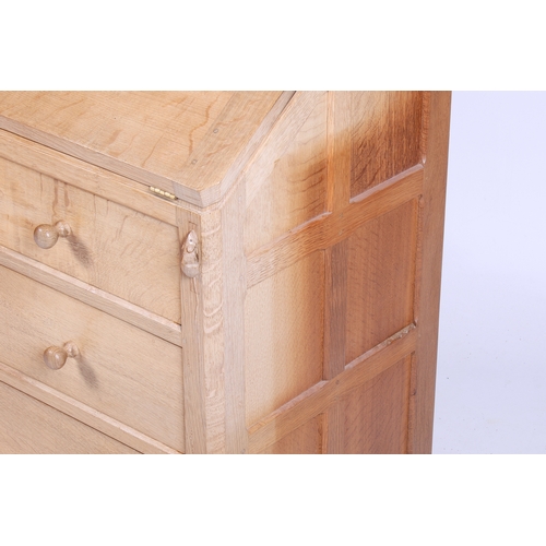 1 - Robert 'Mouseman' Thompson (British, 1876-1975) of Kilburn. A solid, light oak bureau with adzed top... 