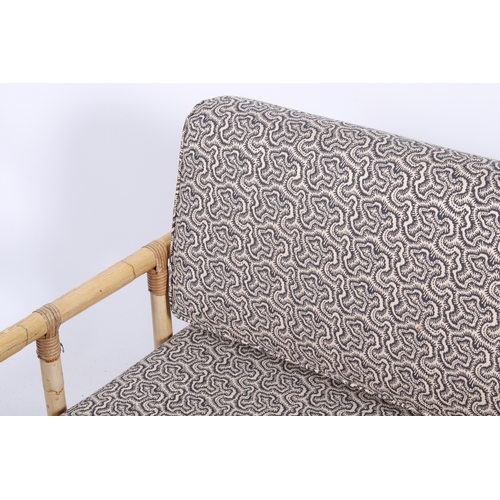 12 - A 20th century bamboo sofa. The cushions later upholstered in Linwood 'Polka in Midnight' repeating ... 