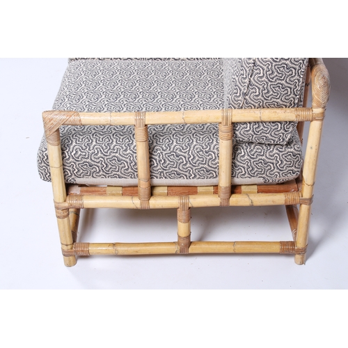 12 - A 20th century bamboo sofa. The cushions later upholstered in Linwood 'Polka in Midnight' repeating ... 