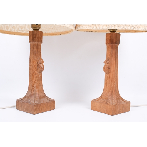 3 - Robert 'Mouseman' Thompson (British, 1876-1975) of Kilburn. A pair of 20th century oak table lamps c... 