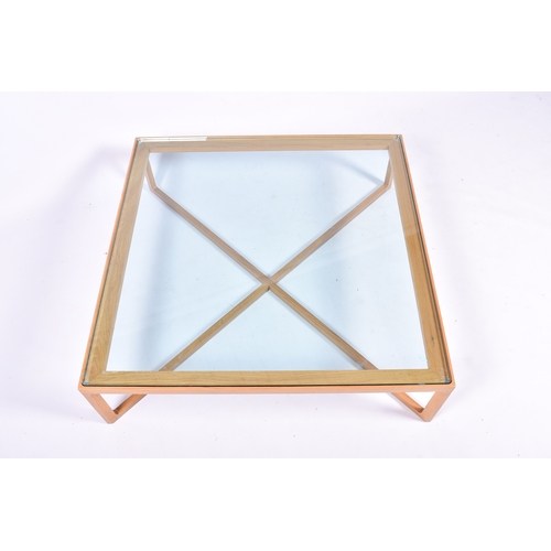30 - A Knoll 'Krusin' light oak coffee table with thick, clear glass top, retailed by Heals. Square bevel... 