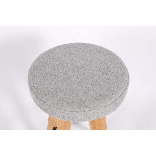 37 - Eight retro style modern bar stools. Upholstered grey seat, sat on angular solid light oak legs with... 