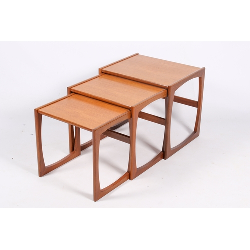 39 - A mid-20th century G-Plan ' Quadrille' nest of three tables. Constructed from teak, supports united ... 