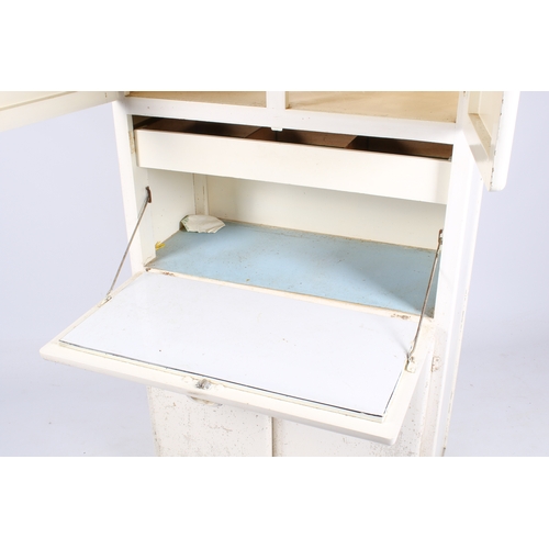 42 - A 20th century retro kitchen unit, painted white. Two-door cupboard above drop down shelf and cupboa... 