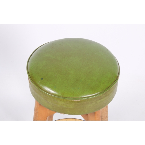43 - A 20th century, retro bar stool. Green upholstered seat, sat on angular, tapering beech legs with me... 