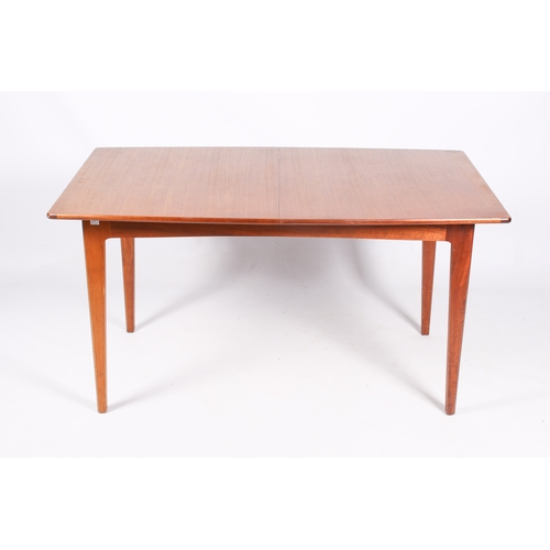 46 - A Danish style, mid-century teak extending dining table and five chairs. Teak frame chairs with blac... 