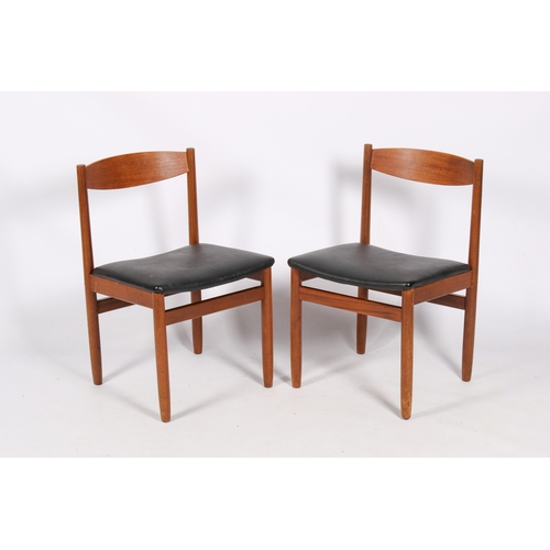 46 - A Danish style, mid-century teak extending dining table and five chairs. Teak frame chairs with blac... 
