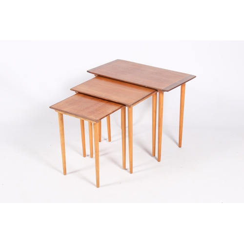49 - A Norwegian mid-century nest of tables by Torpe Mobelfabrikk. Teak tops on tapering beech legs. Tabl... 