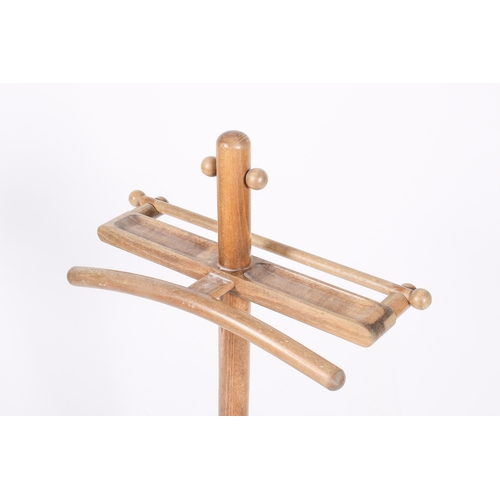 51 - A 20th century retro beech valet stand with atomic ball detailing to the upright and towel rail. H11... 