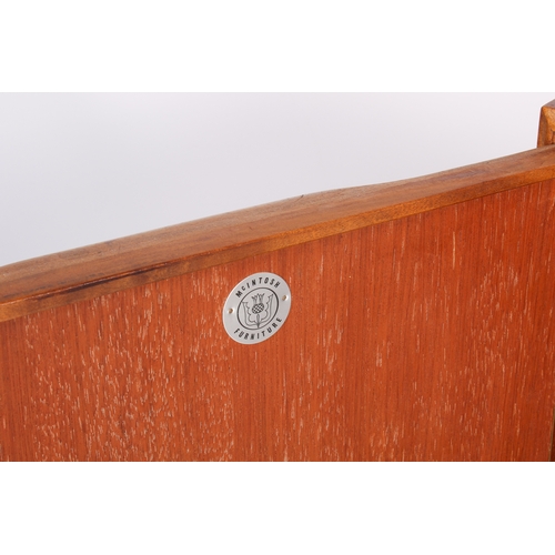54 - A mid-century, McIntosh 'Dunvegan' teak display cabinet. Glass fronted shelves flanked by lipped han... 