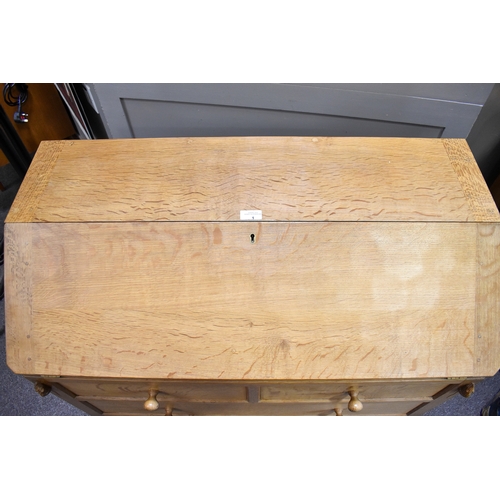 1 - Robert 'Mouseman' Thompson (British, 1876-1975) of Kilburn. A solid, light oak bureau with adzed top... 