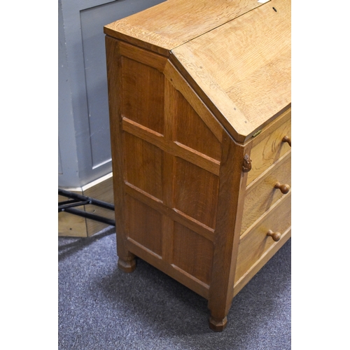 1 - Robert 'Mouseman' Thompson (British, 1876-1975) of Kilburn. A solid, light oak bureau with adzed top... 