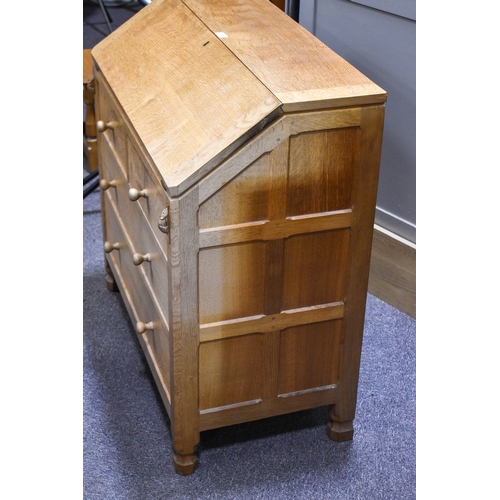 1 - Robert 'Mouseman' Thompson (British, 1876-1975) of Kilburn. A solid, light oak bureau with adzed top... 