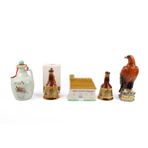 203 - A collection of five assorted novelty ceramic alcohol decanters and contents. Including Beswick Gold... 