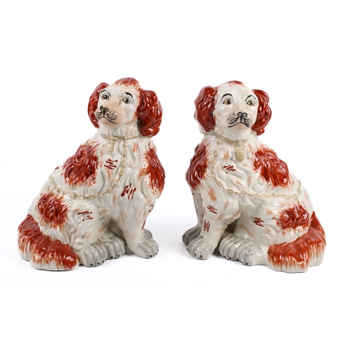 210 - A pair of Staffordshire style King Charles Spaniel dog figures in earthenware pottery, hand painted ... 