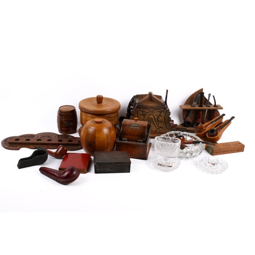 212 - A collection of assorted smoking ephemera. Including pipes, tabacco jars and ash trays, etc. Largest... 